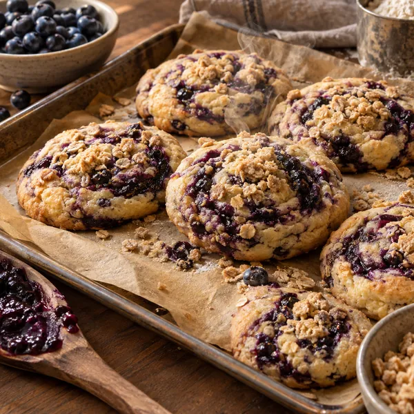 Overhead view of cookies on parchment with a cooling rack
