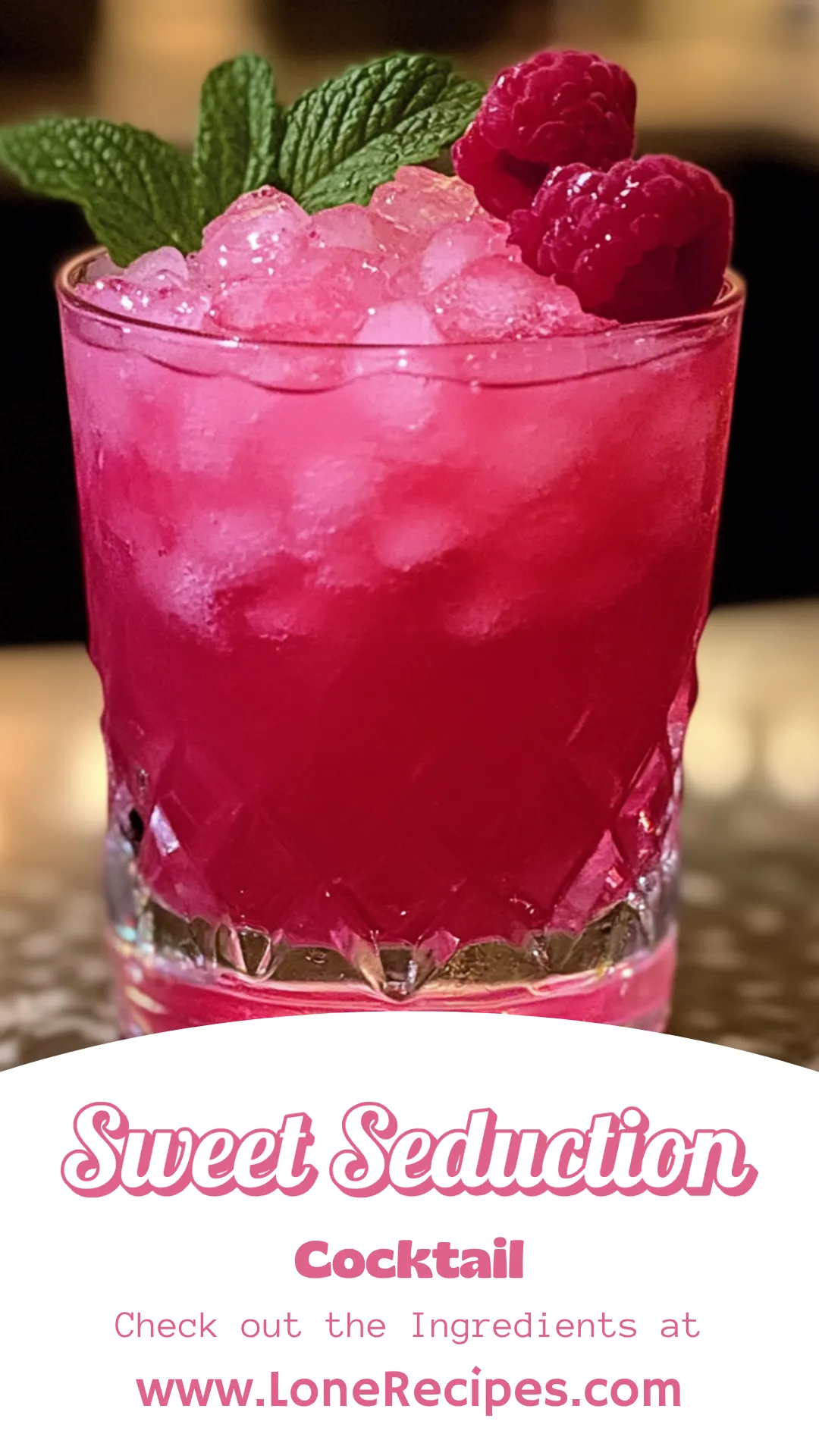 Vibrant magenta cocktail in crystal glass with raspberry and pineapple garnish